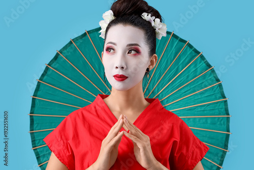 Beautiful young geisha with...