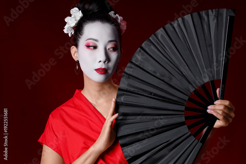 Beautiful young geisha with...