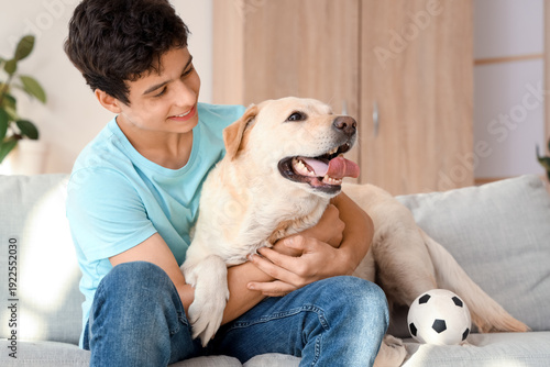 Happy teenage boy with cute...