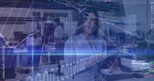 Businesswoman focuses on tablet in modern, bright office for global finance tech.