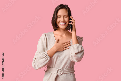 Thankful young woman pressi...