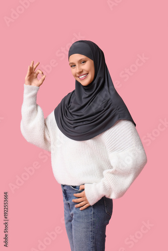 Young Muslim woman showing ...