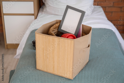 Moving box with things on b...