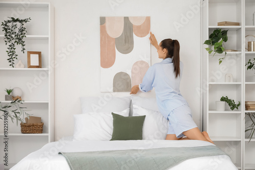 Young woman hanging stylish...