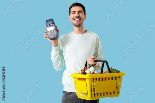 Young man with full shoppin...