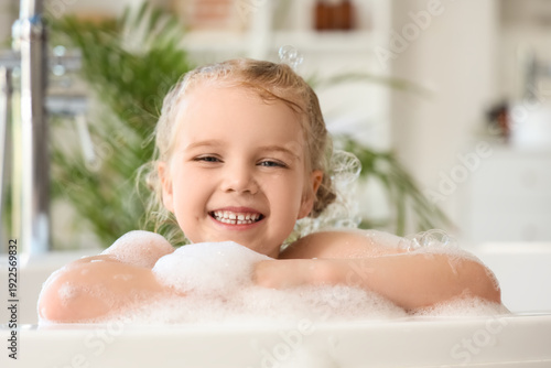 Cute little girl taking bat...