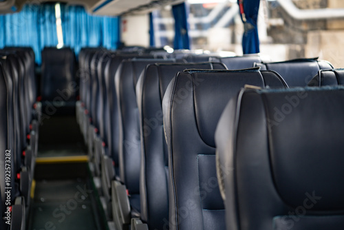 Interior of a bus with empty seats and seats in a row