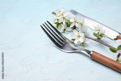Silver cutlery with blossom...