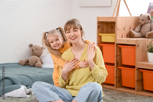 Cute little girl hugging na...