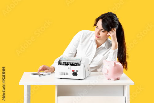Young woman counting money ...
