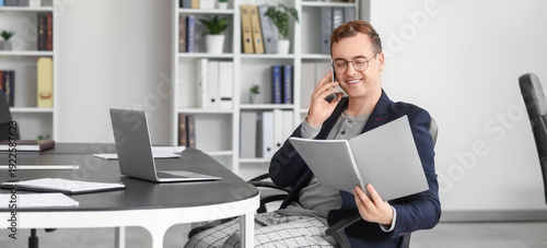 Young businessman with fold...