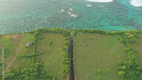 Scenic aerial view of coastal road Tanah barak and turquoise ocean in bali