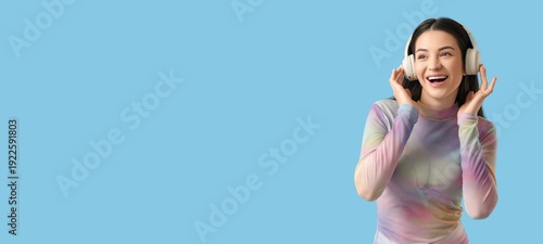 Smiling woman in headphones...