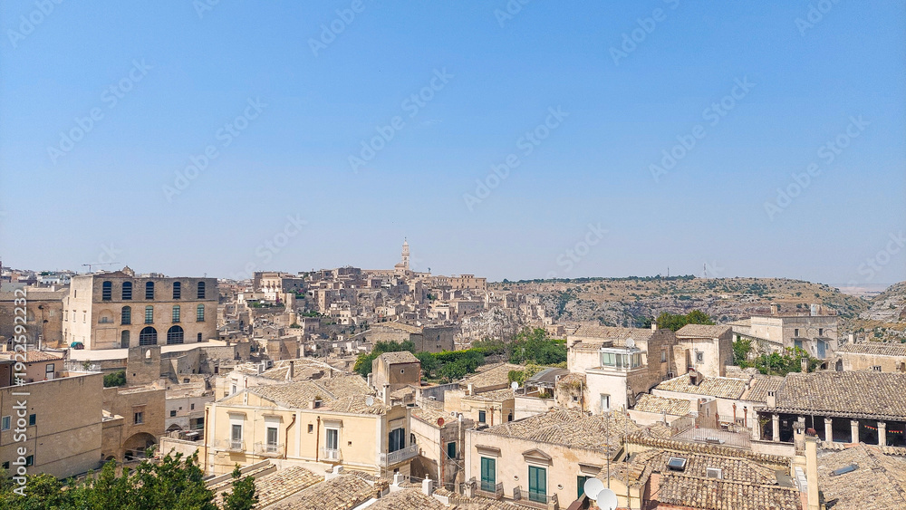 Obraz premium Sunny panoramic view of the ancient Sassi di Matera district, Basilicata, Italy.