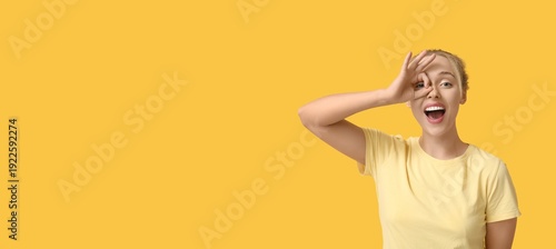Happy young woman showing g...