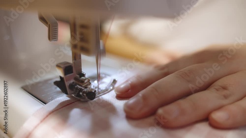 Sewing on a machine, close-up of needle and fabric