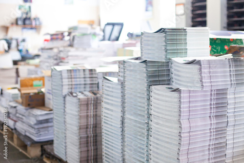 Foto Stacks of printed magazines in commercial print shop