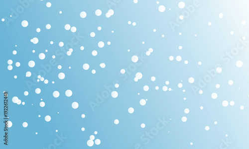 Winter blue background with raindrops and snowflakes on a cold window glass texture