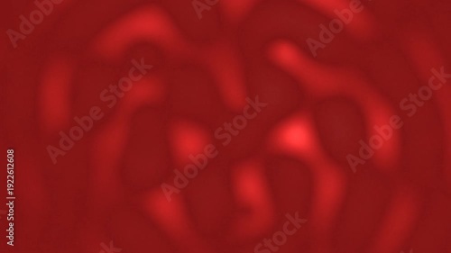 Abstract motion creates a blurred background effect in red tones.