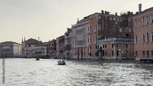 Tranquil boat journey along historic venetian canal at dusk