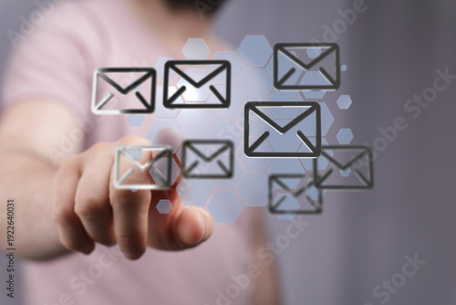 Hand pressing on email symb...