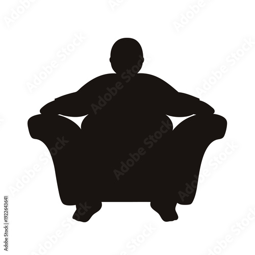 Silhouette of a person sitting in a large, comfortable armchair or sofa