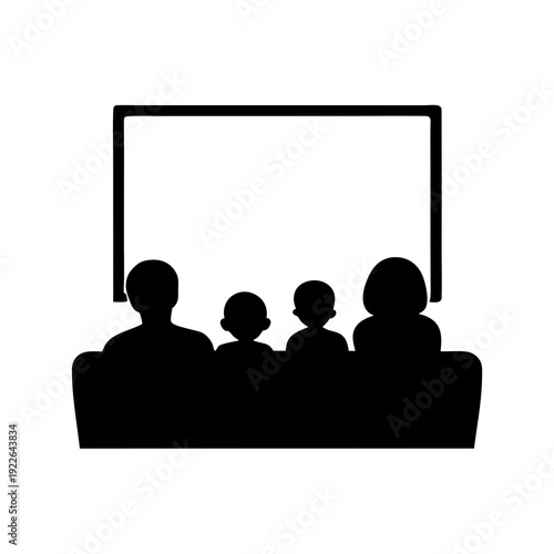 A family is watching a movie together at home in silhouette