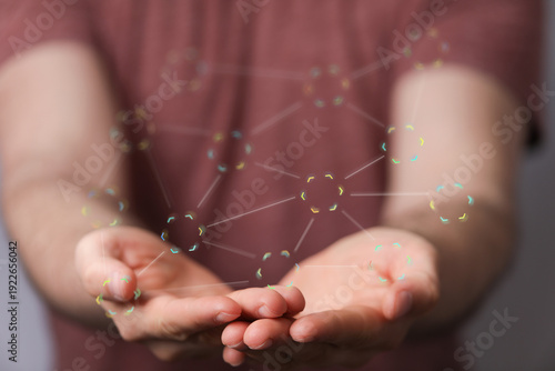 Close up of hands holding a...