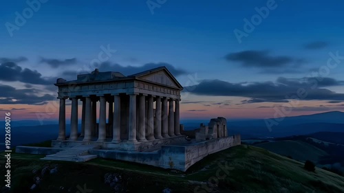 Wallpaper Mural Ancient classical temple ruins on a grassy hilltop under a dramatic sunset sky with moving clouds Torontodigital.ca