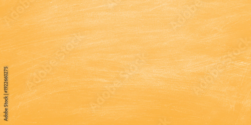 Abstract orange background features an orange peel pattern on a textured wooden board with a natural brown timber grain surface