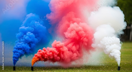 Colorful Smoke Bombs on Green Grass.