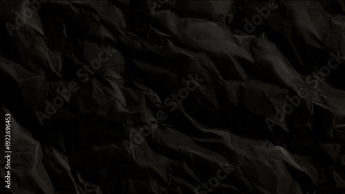 Crumpled black paper texture background for creative design projects and abstract visuals
