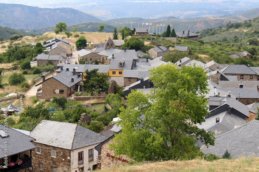 Fototapeta premium Approaching El Acebo de San Miguel from the Mountain Above Manjarin July 2024