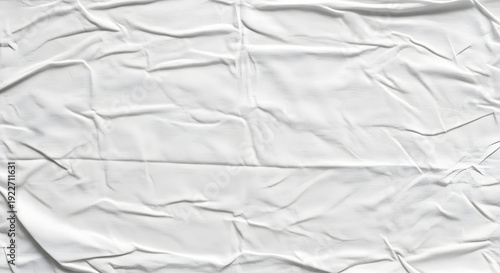Crumpled white fabric texture with wrinkled surface and creased details for design and background use