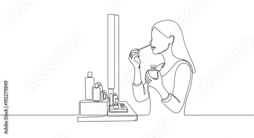 Woman applying perfume while sitting at cosmetics counter  