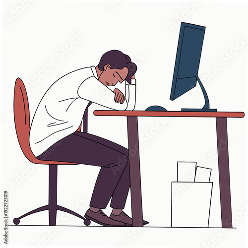 Man sitting at desk looking tired and stressed