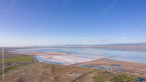 Lake Chaka Aerial View with Salt Ponds and Mountain Range
