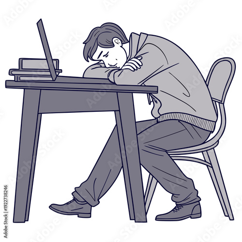 A man sitting at a desk looking tired