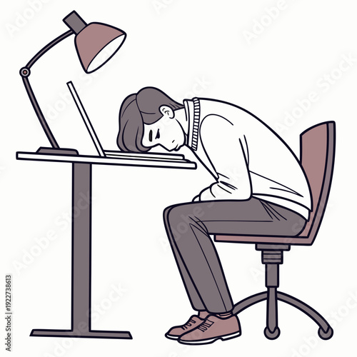 A man sleeping at his desk with a lamp on
