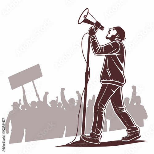 A man speaks into a megaphone in front of a crowd