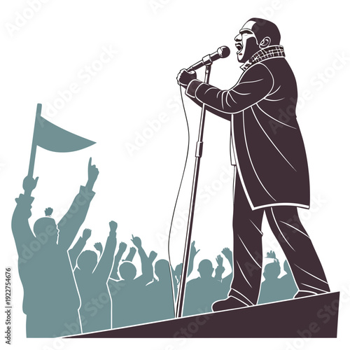 A man speaks into a microphone on a stage with a crowd