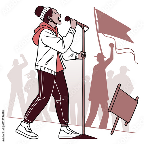 A woman speaks into a microphone while people wave a flag in the background