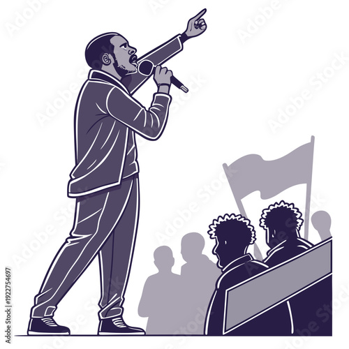 A man in a suit speaks into a microphone to a crowd