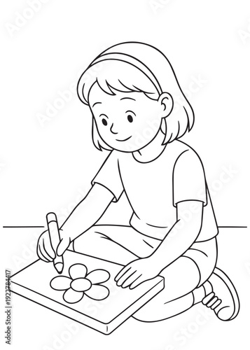 coloring book  girl coloring a flower picture while seated cross-legged
