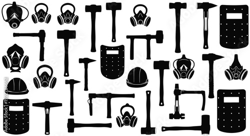 Collection of black industrial tools and safety equipment arranged neatly on a clean surface, viewed directly from above