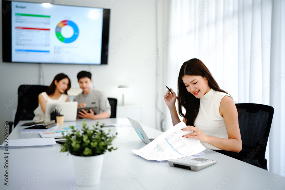 Fototapeta premium Female leader, manager or CEO with a smile, mission and vision in the office and her team in the background. Leadership, management and success with a woman boss and corporate business people at work