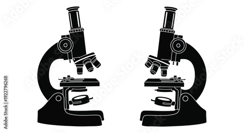 Two black silhouette microscopes facing each other on a white background