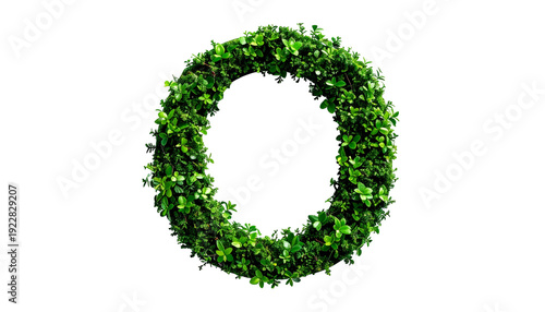 Circular wreath composed of densely packed, vibrant green leaves on a black background