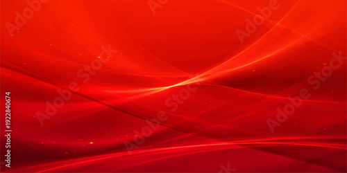 Smooth red satin fabric with flowing waves and soft curves creates an elegant silk texture backdrop featuring light motion on a luxurious cloth material