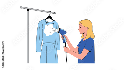 Young woman with blonde hair uses a blue handheld garment steamer to remove wrinkles from a light blue dress hanging on a rack.